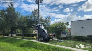Driver Arrested After Car Lands on Its Back Wheels in Holiday Crash